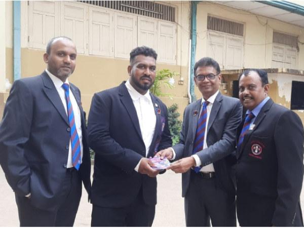 Handing over Voucher to the Boxing Coach